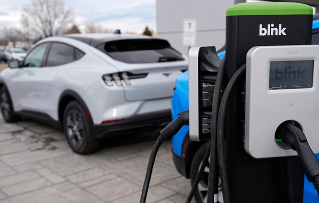 Electric vehicle chargers sit outside a Ford dealership in Broomfield, Colorado