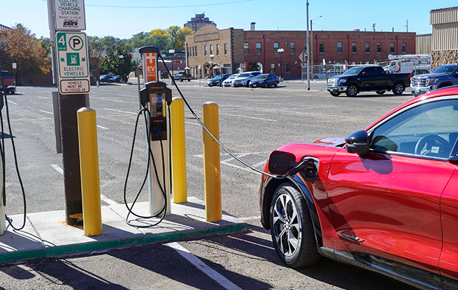 An electric vehicle at a charging station in Pueblo's Union Avenue Historic District