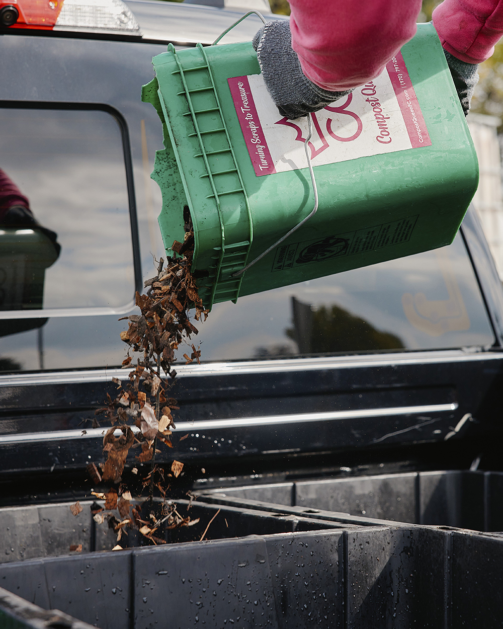 Man holding a compost bin