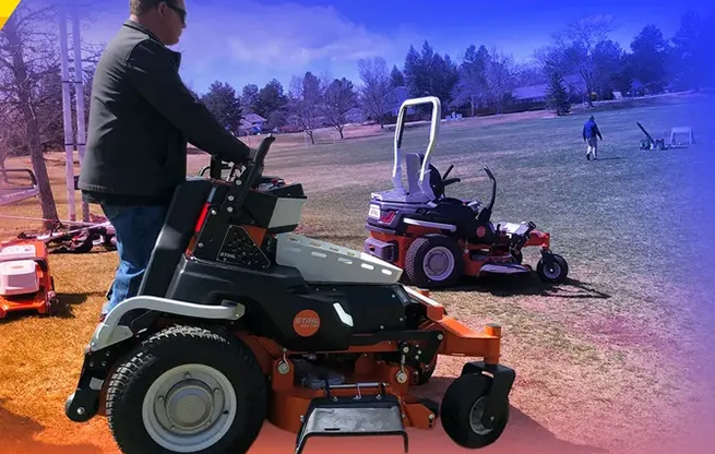 Landscaper operating an electric riding mower